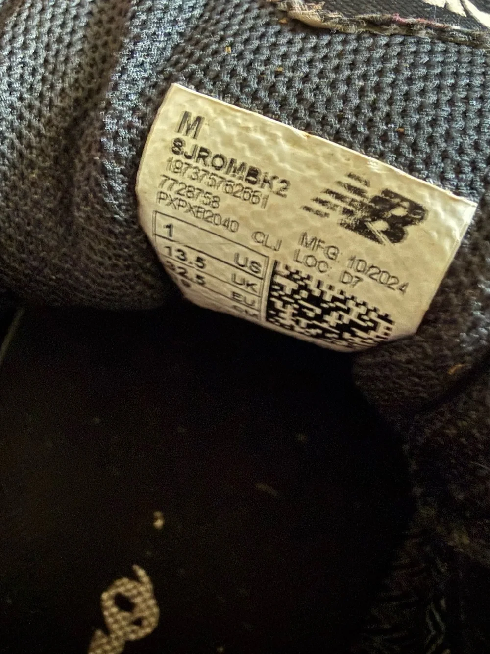 New Balance Black and white Romero Cleats